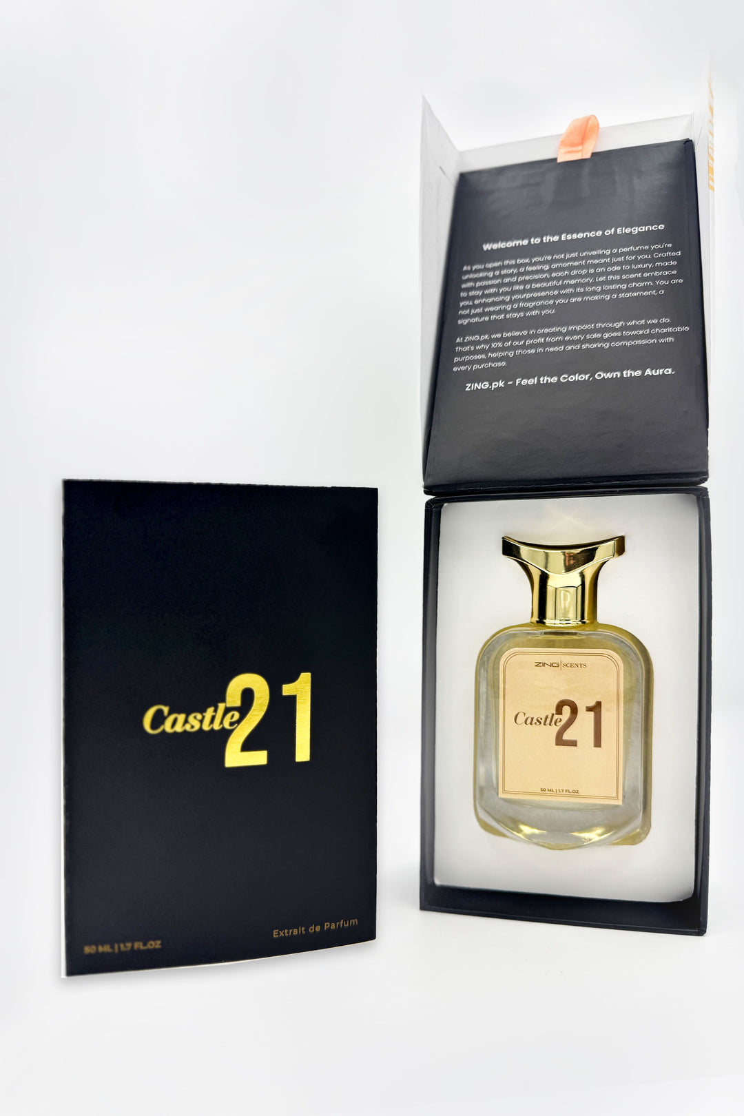 Castle 21 perfume bottle in a black box with gold lettering, showing elegant packaging with the bottle inside the box and the lid open