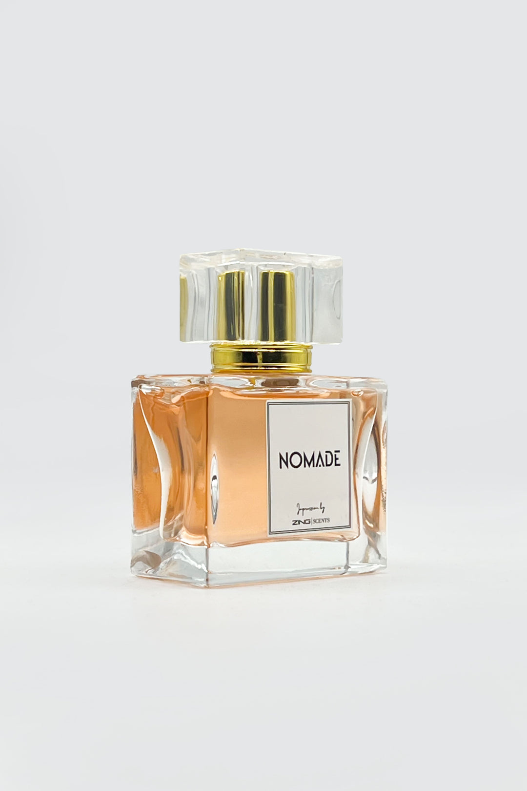 nomade perfume bottle displayed on grey background