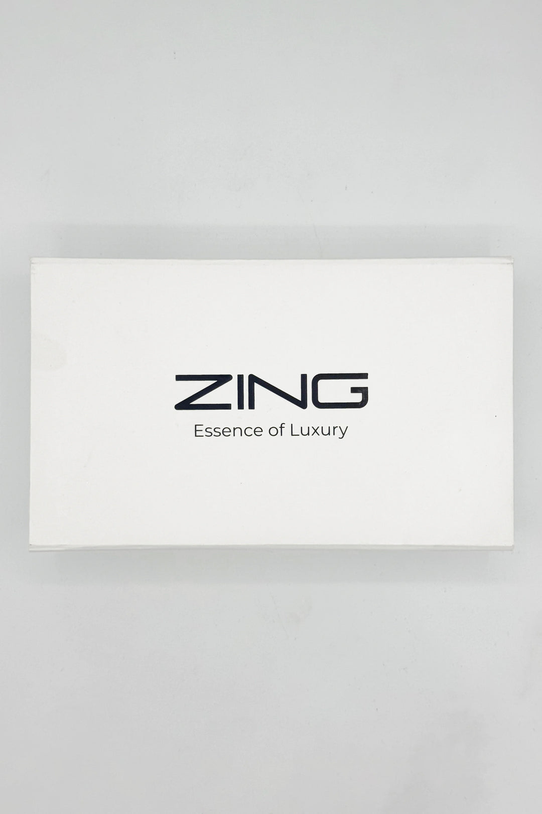 ZING white bundle box with text ZING Essence of Luxury written on top