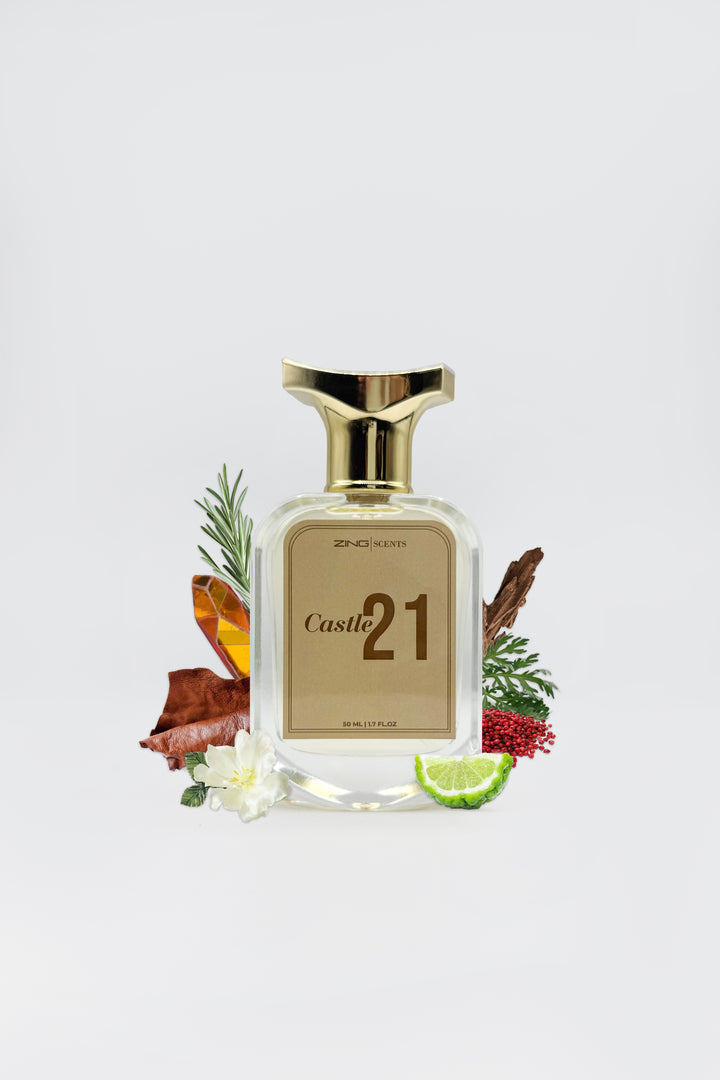 Castle 21 perfume bottle by ZING surrounded by woody notes, citrus, florals, and aromatic herbs displayed on a white background