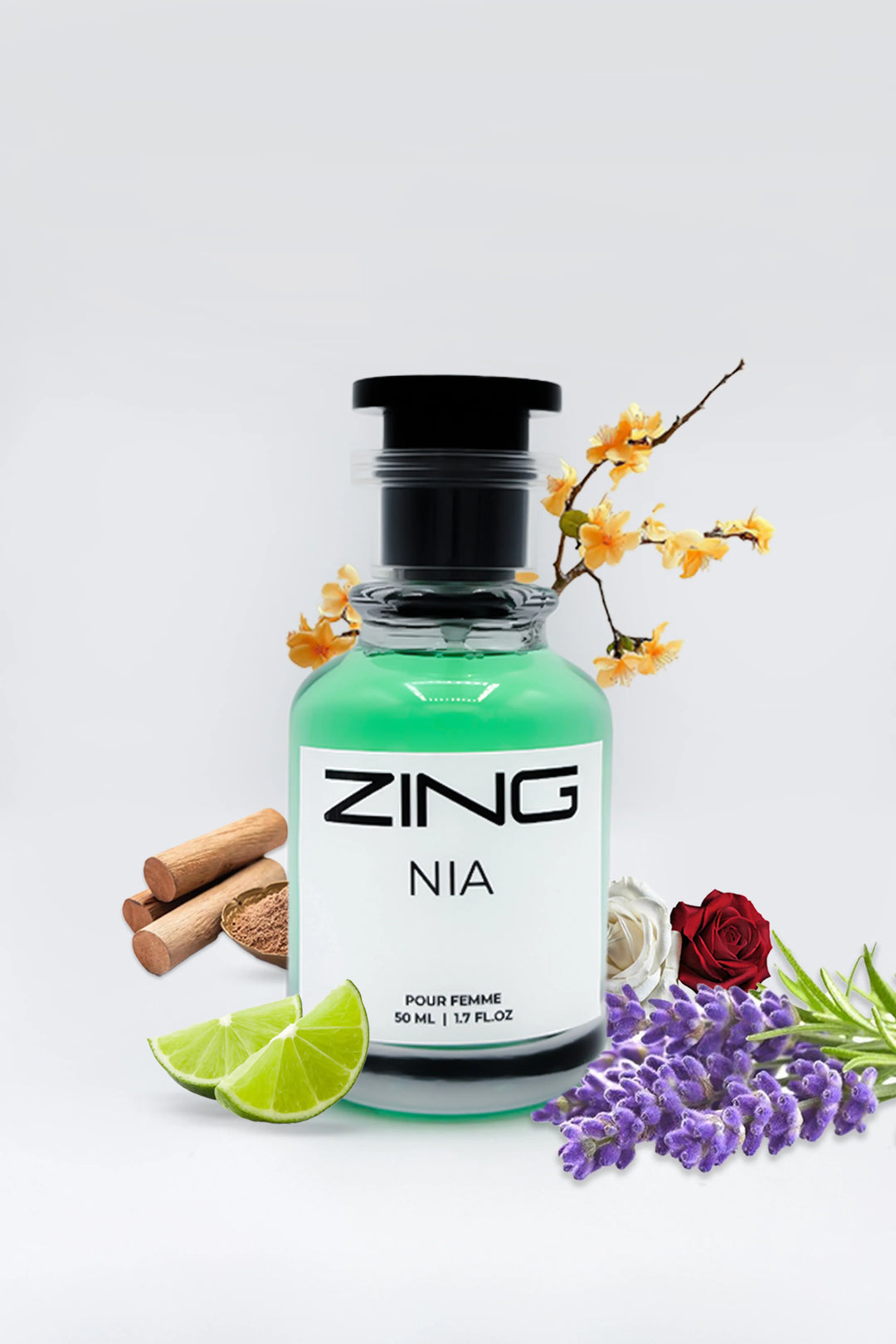 NIA perfume bottle surrounded by lime slices, lavender, red and white roses, cinnamon sticks, and delicate yellow blossoms
