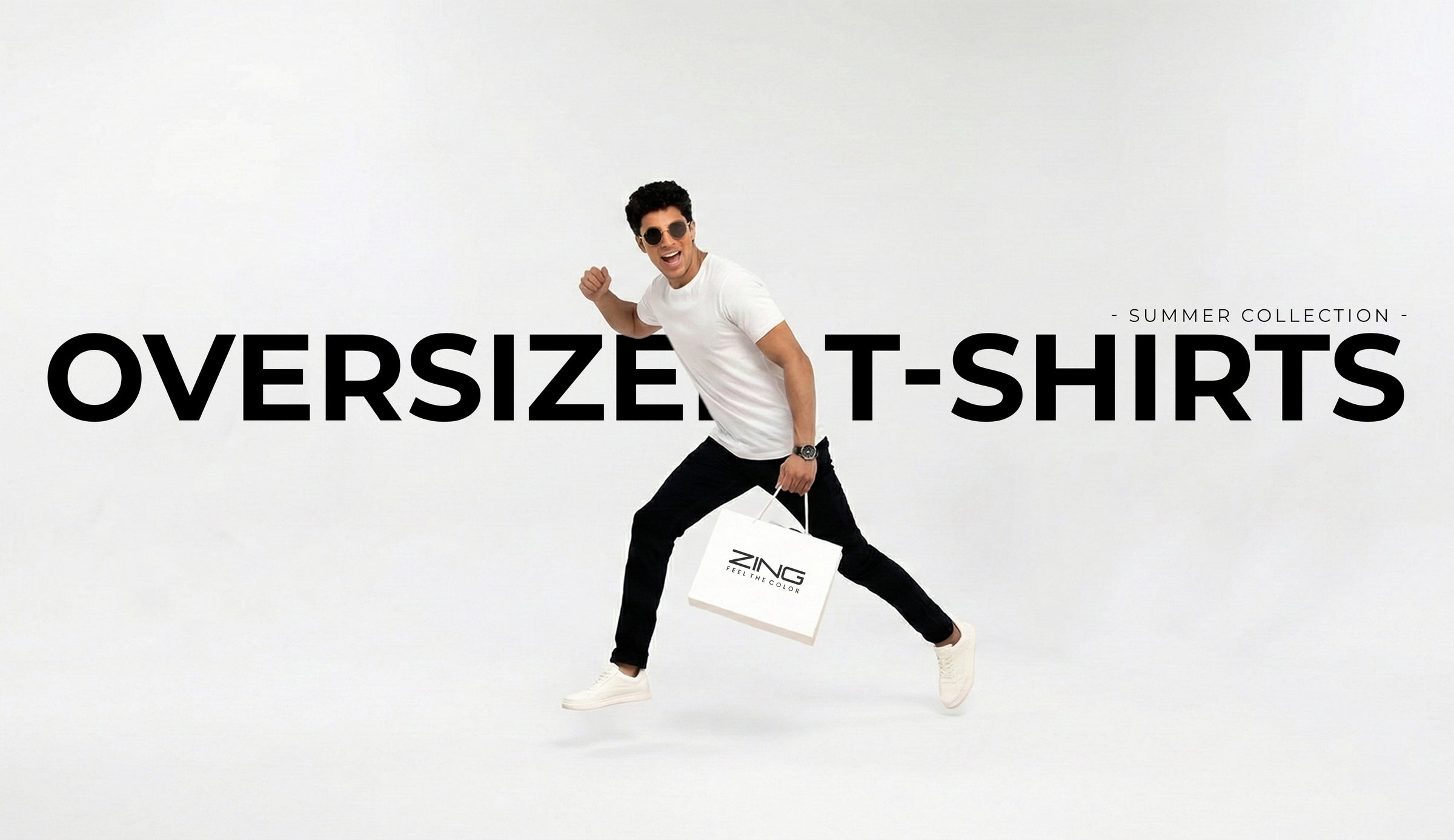 model wearing ZING oversized white t-shirt from summer collection carrying a shopping bag