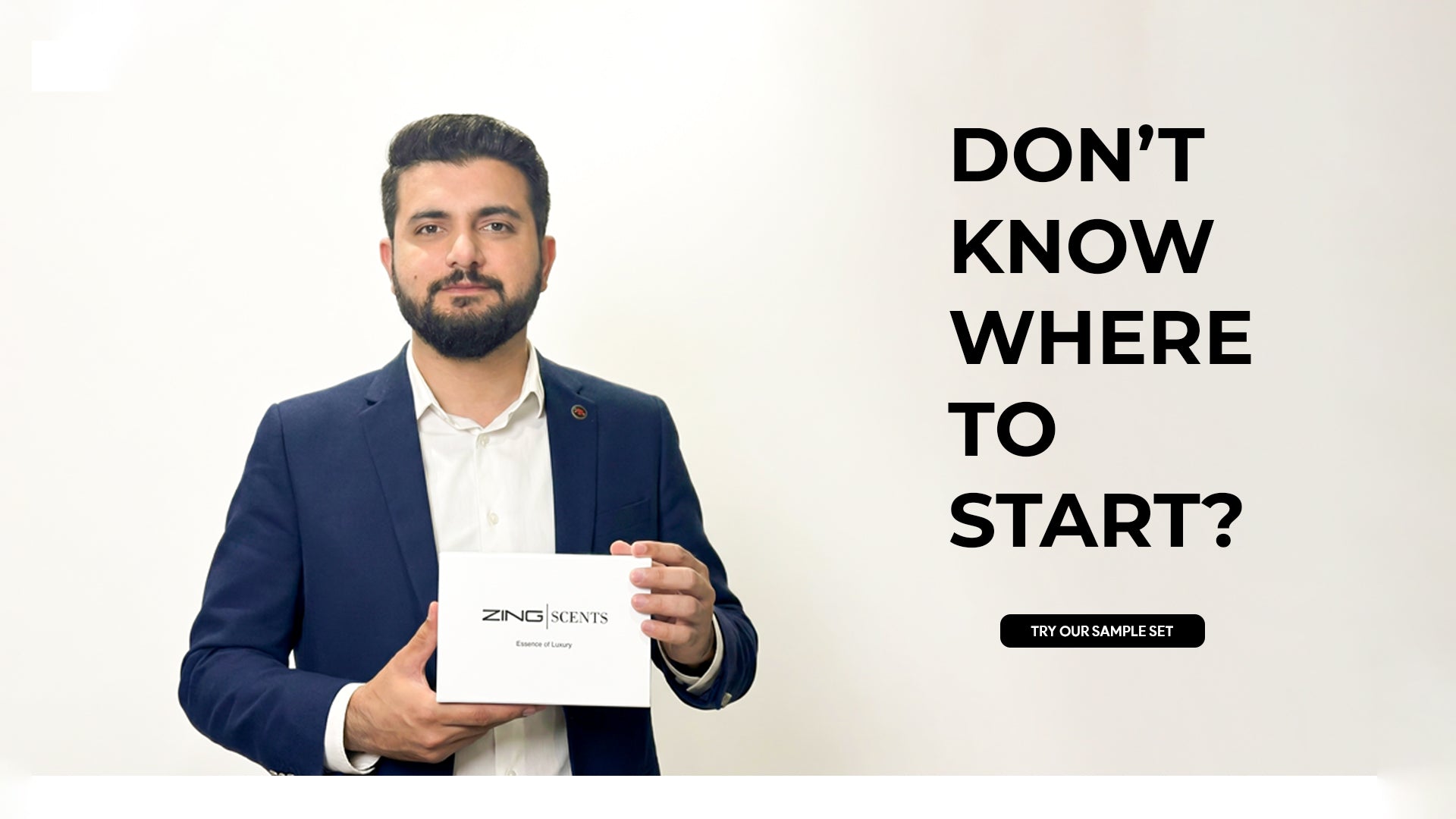 man holding ZING perfume sample set box to help customers choose the right fragrance